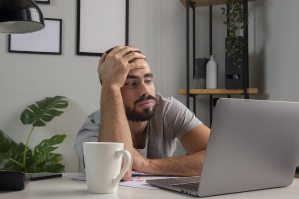 man-feeling-bored-while-working-from-home